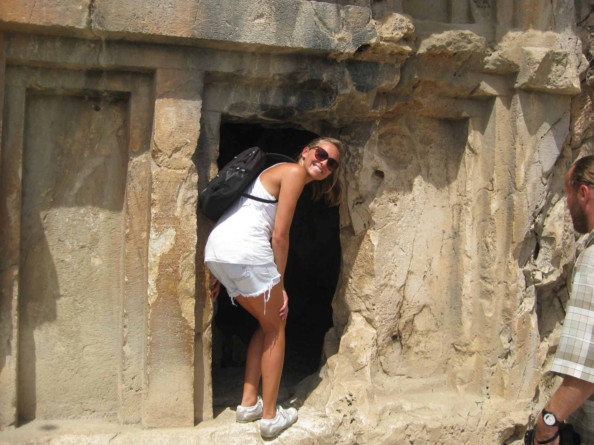 Kristi peeking into a rock tomb, Myra