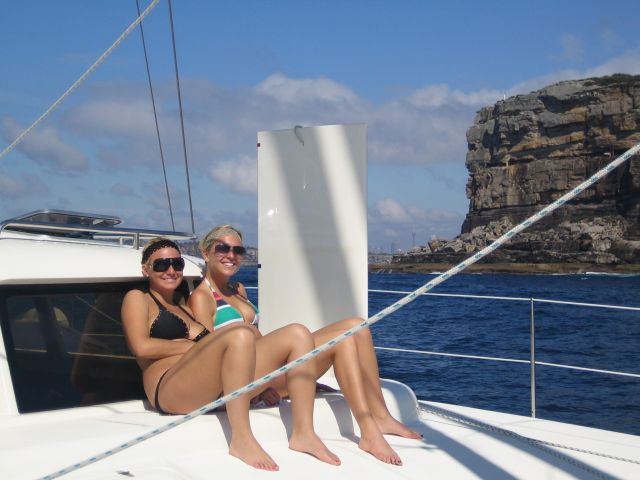 Kristi and Lagen Passing Sydney cliffs at harbor entrance