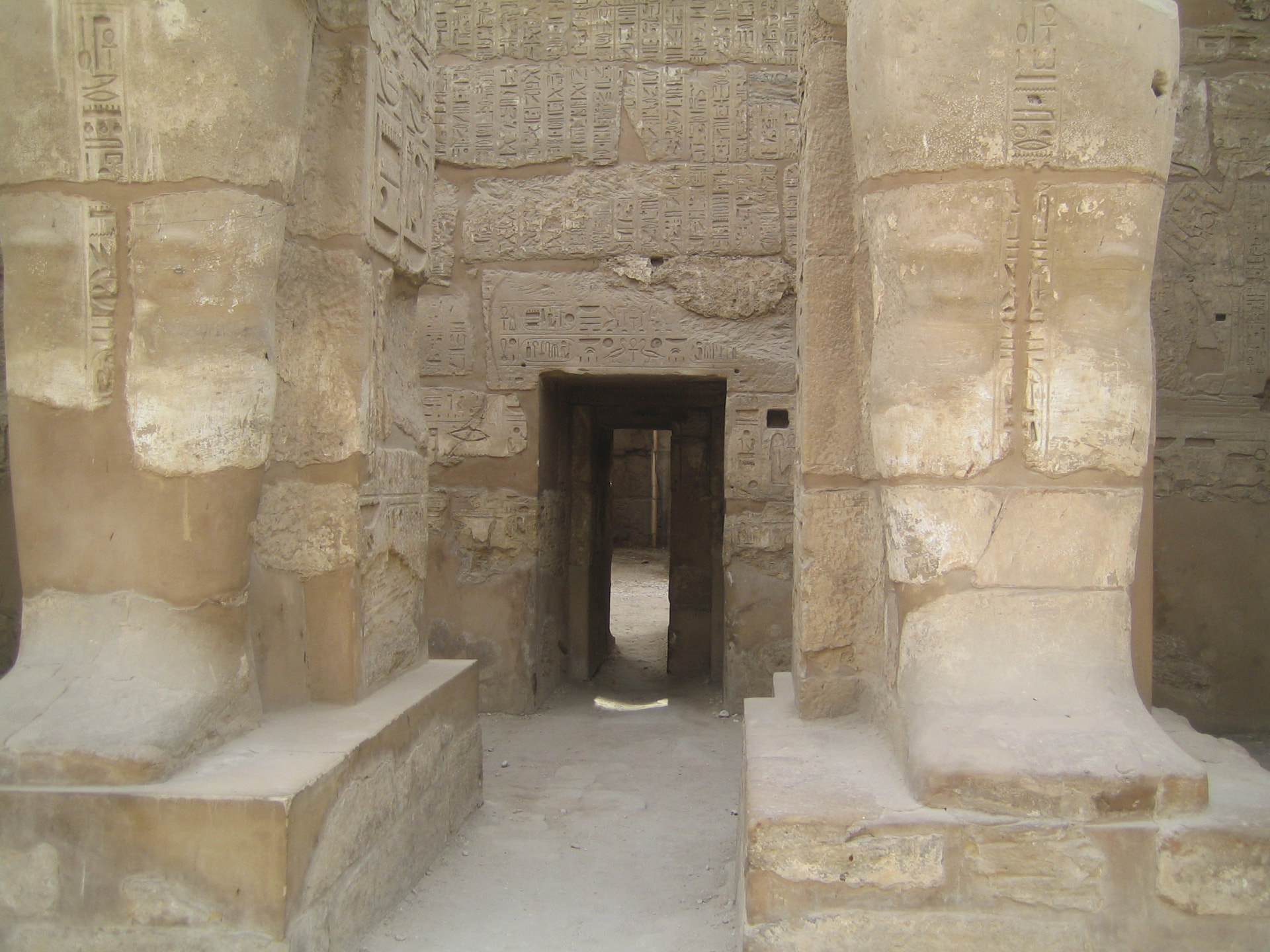 Walking between the colossal statues, Karnak