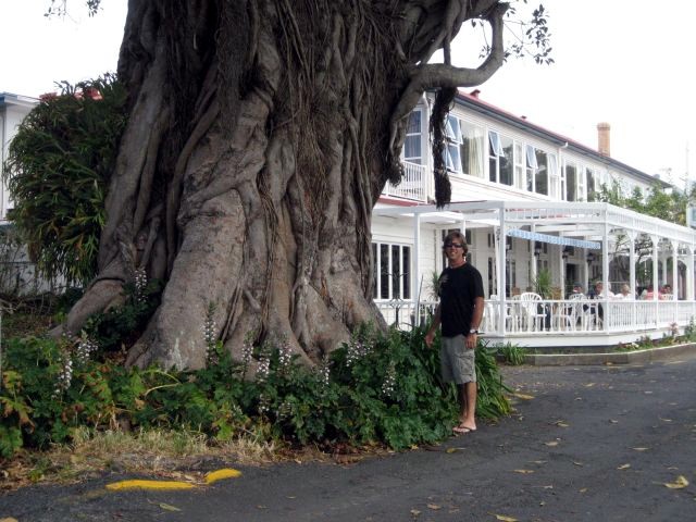 Russell in front of large tree