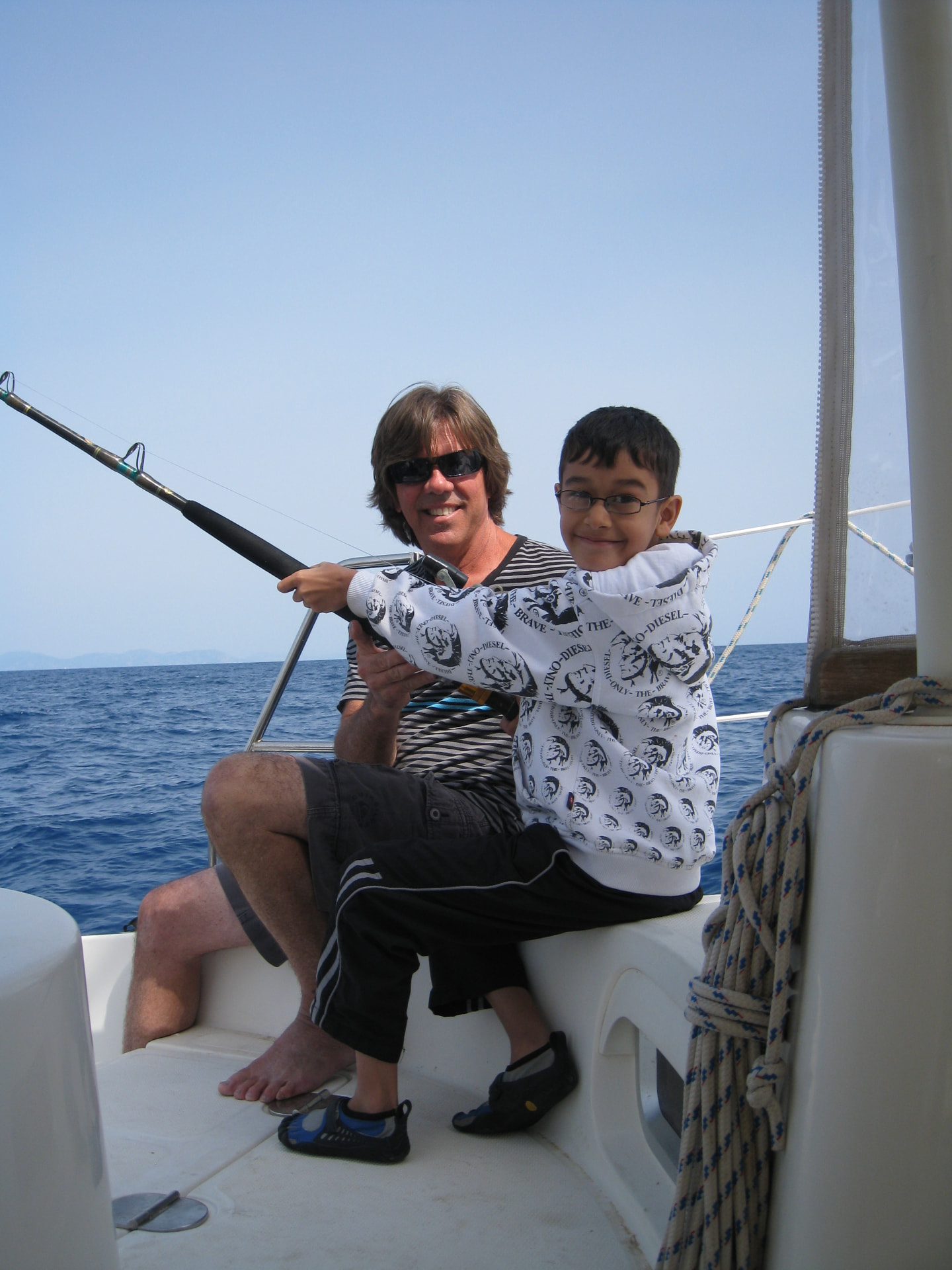 Russell & Indi - learning to fish in Greek Islands